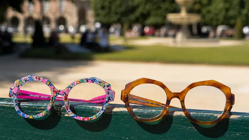 Two decorated Francis Klein frames photographed at the Place des Vosges in Paris