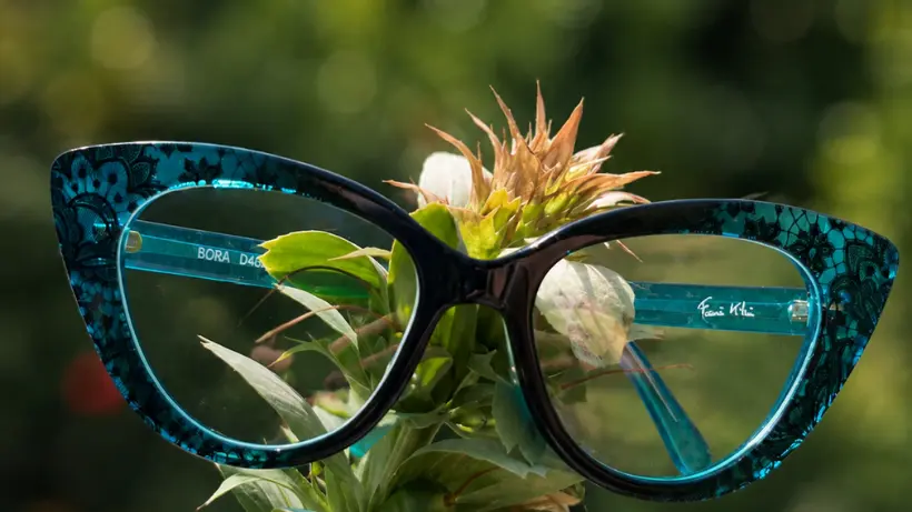 A Francis Klein cat-eye frame in graded acetate, its marbling running through the material